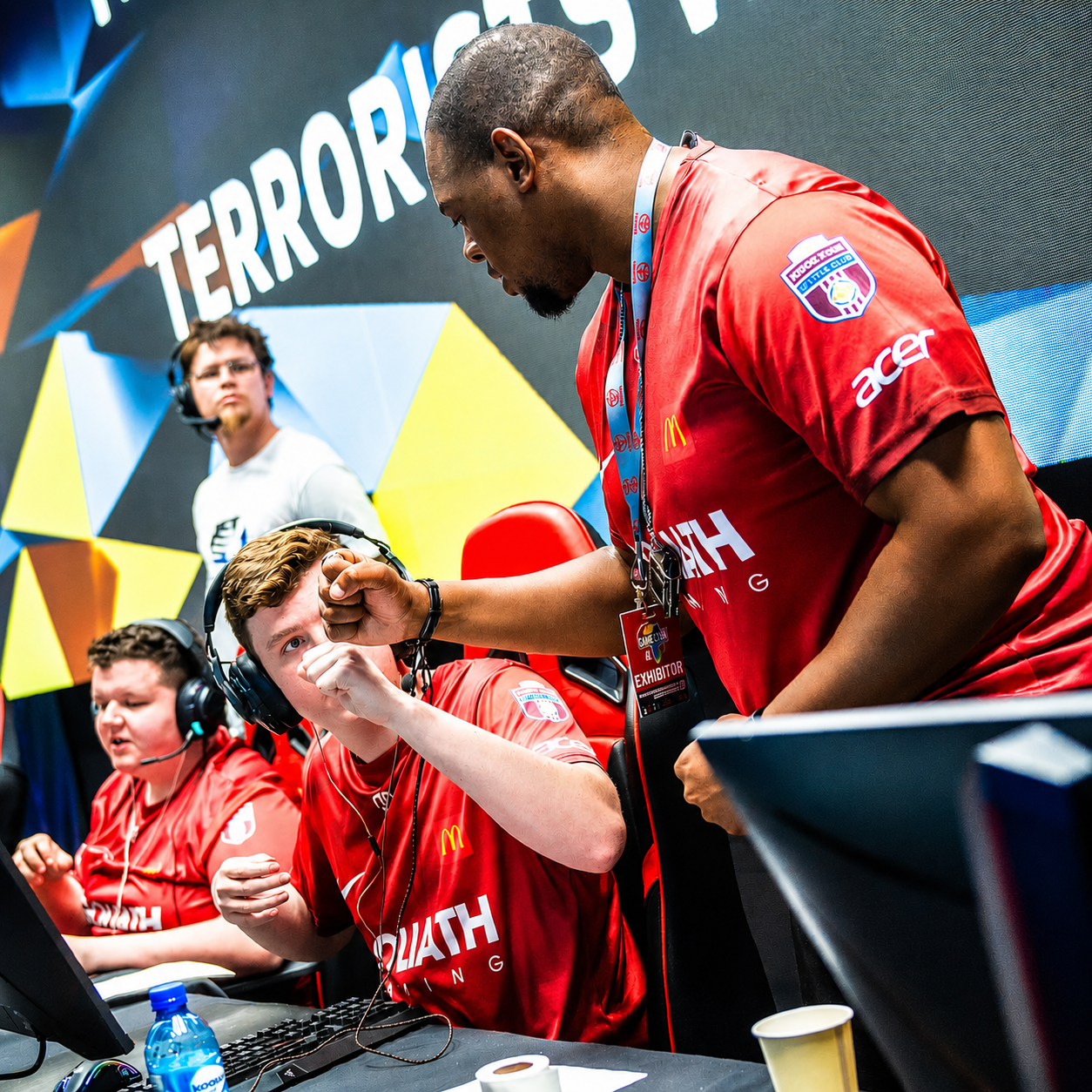 Goliath Gaming players celebrating at an esports event